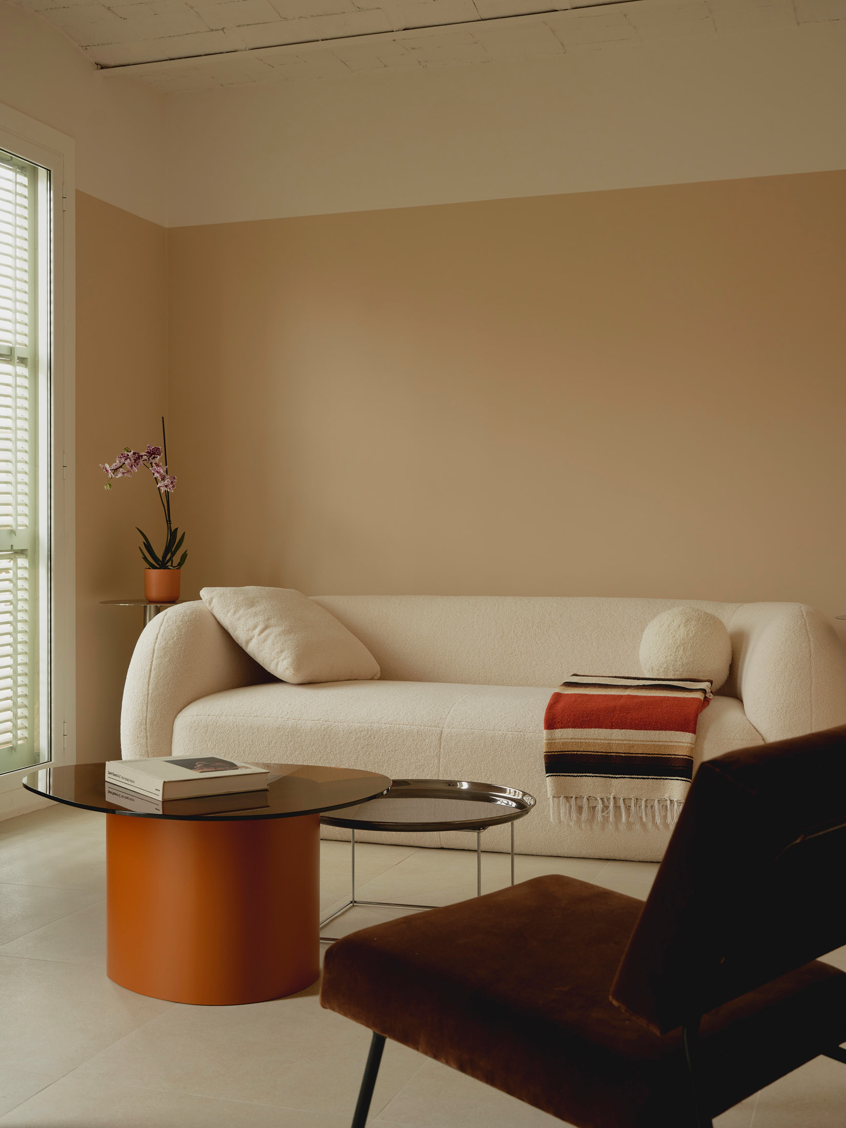 Viladomat Apartment in Barcelona by Colombo Architecture - living area with vintage brown velvet armchair
