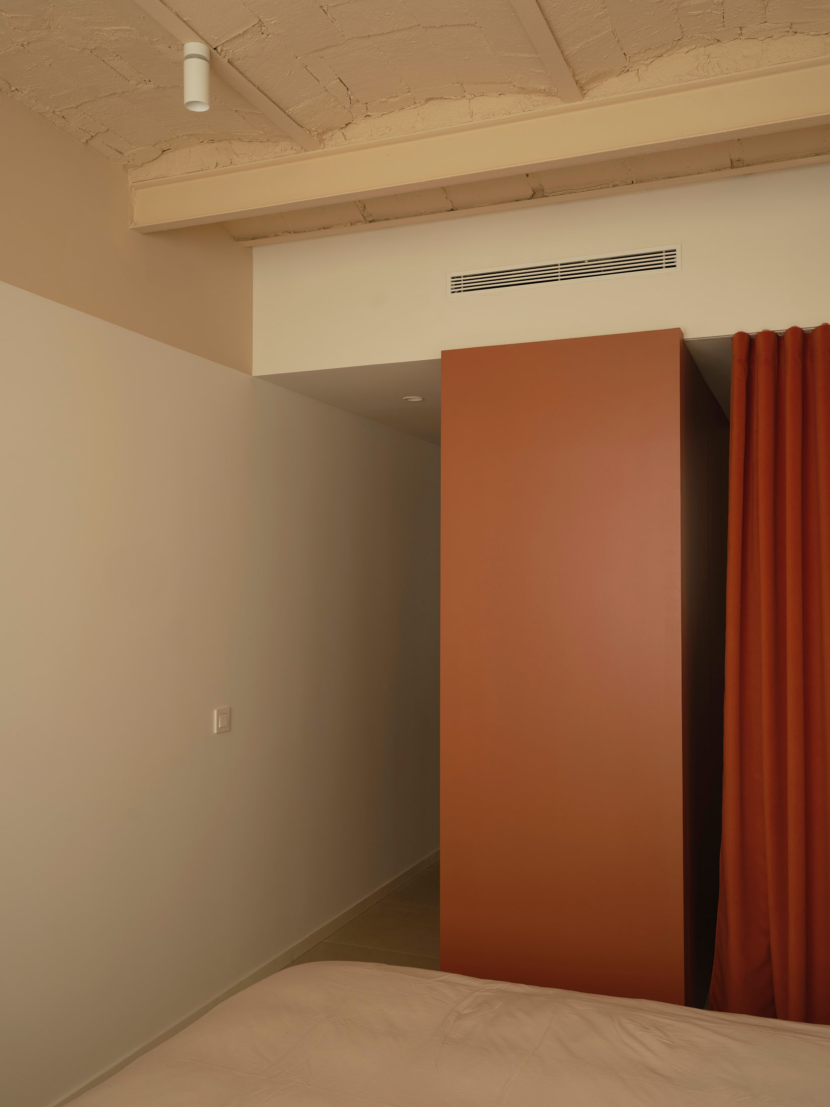 Viladomat Apartment in Barcelona by Colombo Architecture - bedroom view towards the walk-in closet